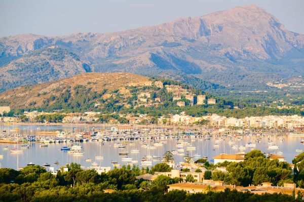 Port de Pollença coastline in Mallorca, popular with British expats seeking UK pension and investment advice