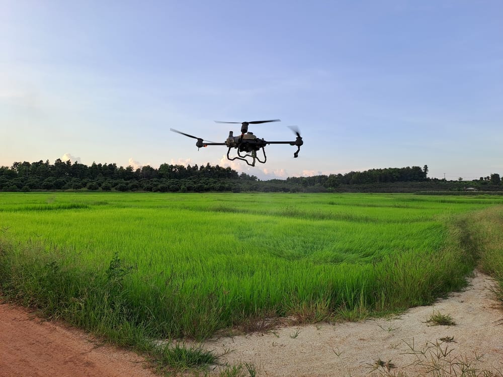 Industrial agricultural drone in field near Swindon Industrial agricultural drone flying over a field, representing Swindon’s growing drone industry, innovation economy and investment potential