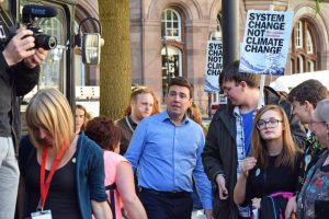 Andy Burnham speaking to a crowd during a political speech on the UK economy and Labour policy