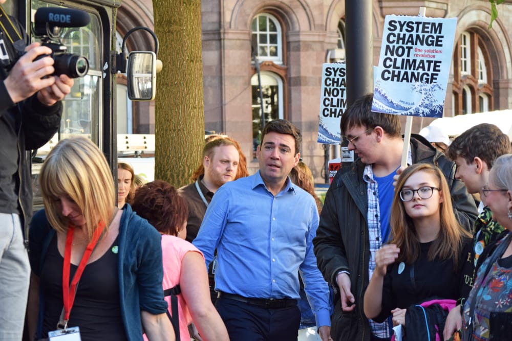 Andy Burnham speaking to a crowd during a political speech on the UK economy and Labour policy